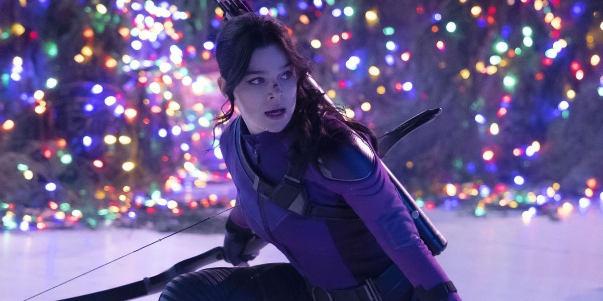 Kate Bishop crouching in front of a Christmas tree on Hawkeye