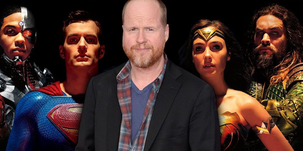 Joss Whedon in front of the cast of Justice League.