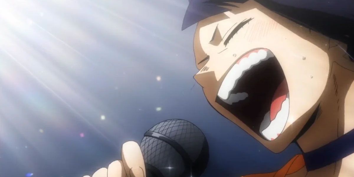 Kyoka sings into a mic