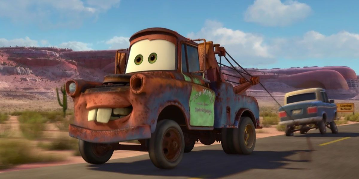 Mater smiles and tows a car