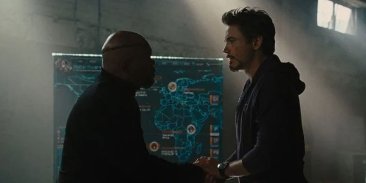 Nick Fury and Tony Stark talk in front of a SHIELD electronic map in Iron Man 2