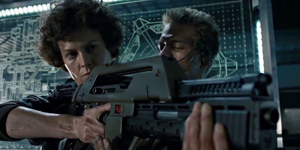 Ellen Ripley learning to use a pulse rifle in Aliens movie
