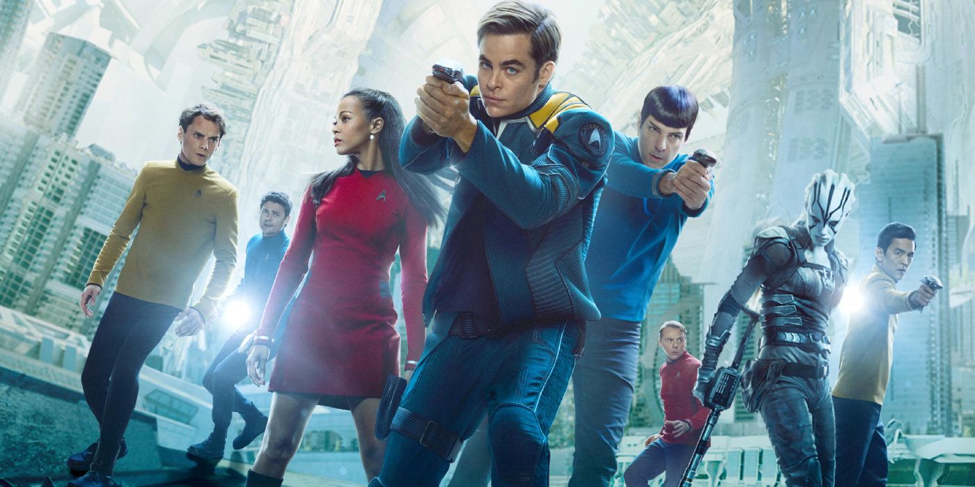The Cast Of Star Trek Beyond with Kirk and Spock holding guns and buildings collapsing. 