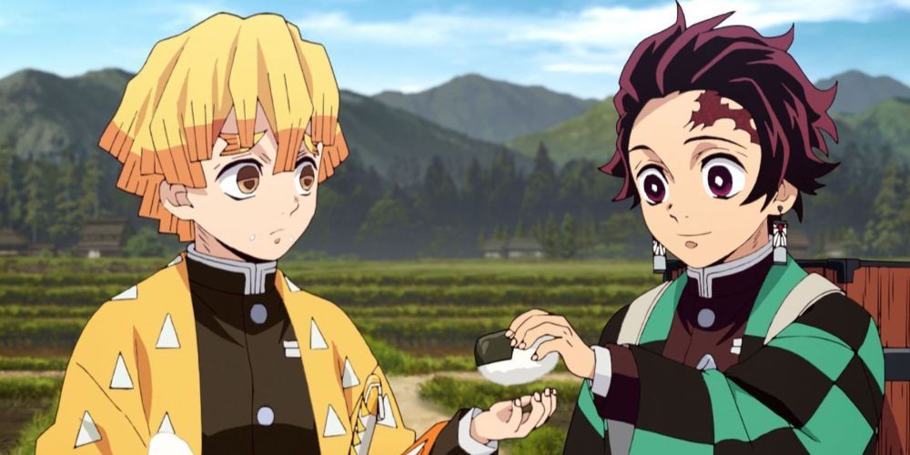 Zenitsu gets food from Tanjiro