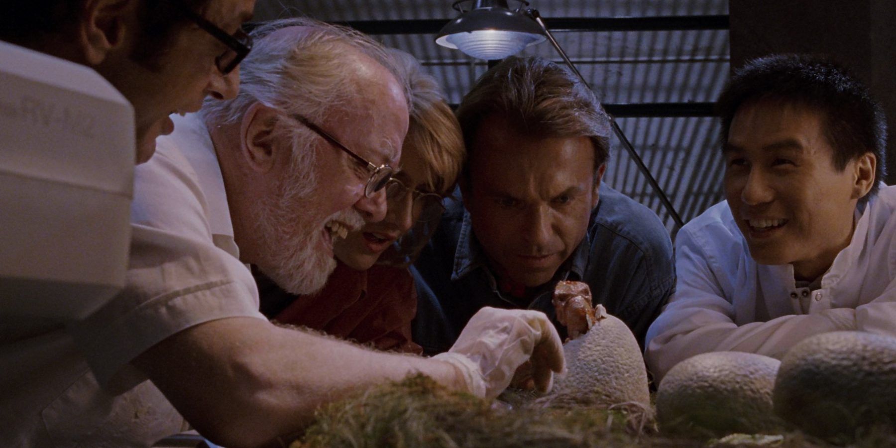 Dr. Sattler, Dr. Malcolm. Dr. Grant, Dr. Wu and John Hammond with a Velociraptor egg in Jurassic Park