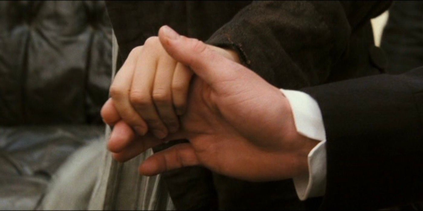 Mr. Darcy's hand holding Elizabeth's hand in Pride and Prejudice 2005