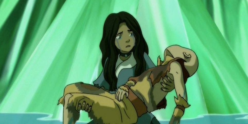 Katara holding an unconscious aang