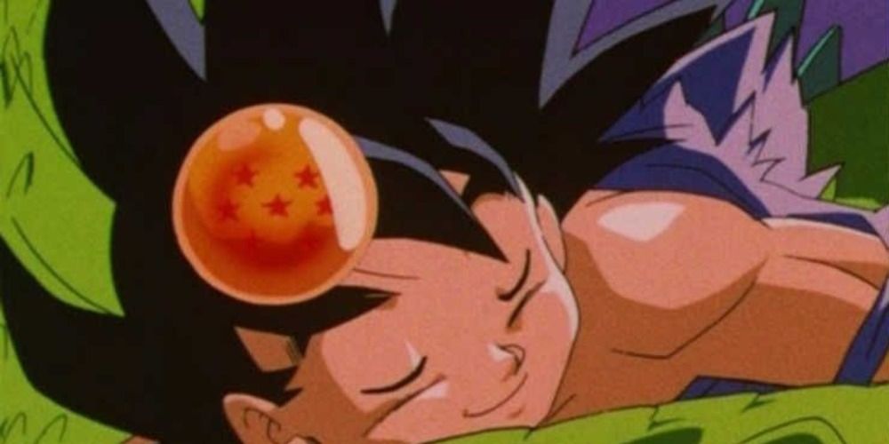 Goku, com uma Dragon Ball na cabeça, abraça Shenron no final de Dragon Ball GT