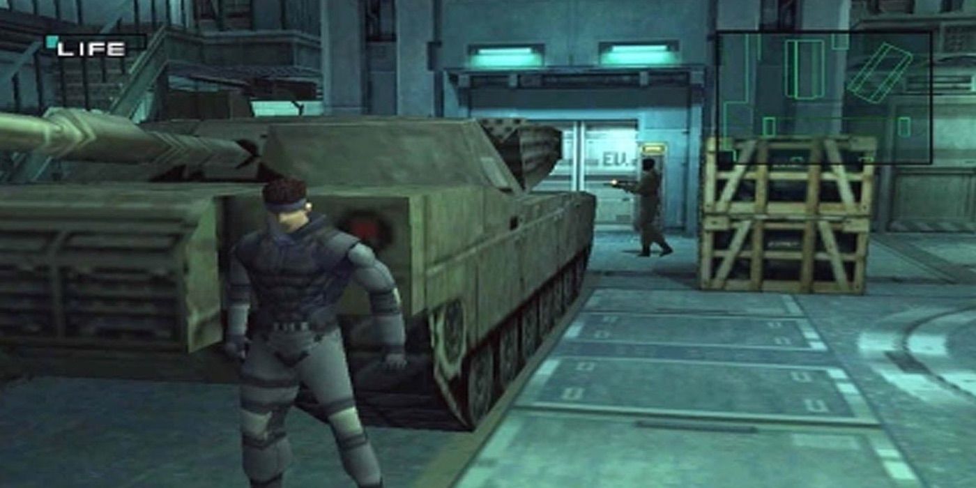  Solid Snake hiding behind a tank in PlayStation's Metal Gear Solid.