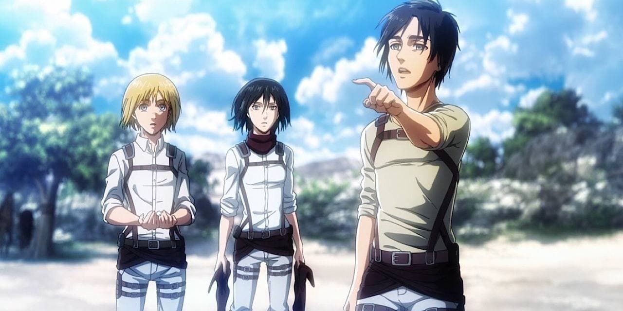 Eren pointing at the horizon with Mikasa and Armin behind him in Attack On Titan.