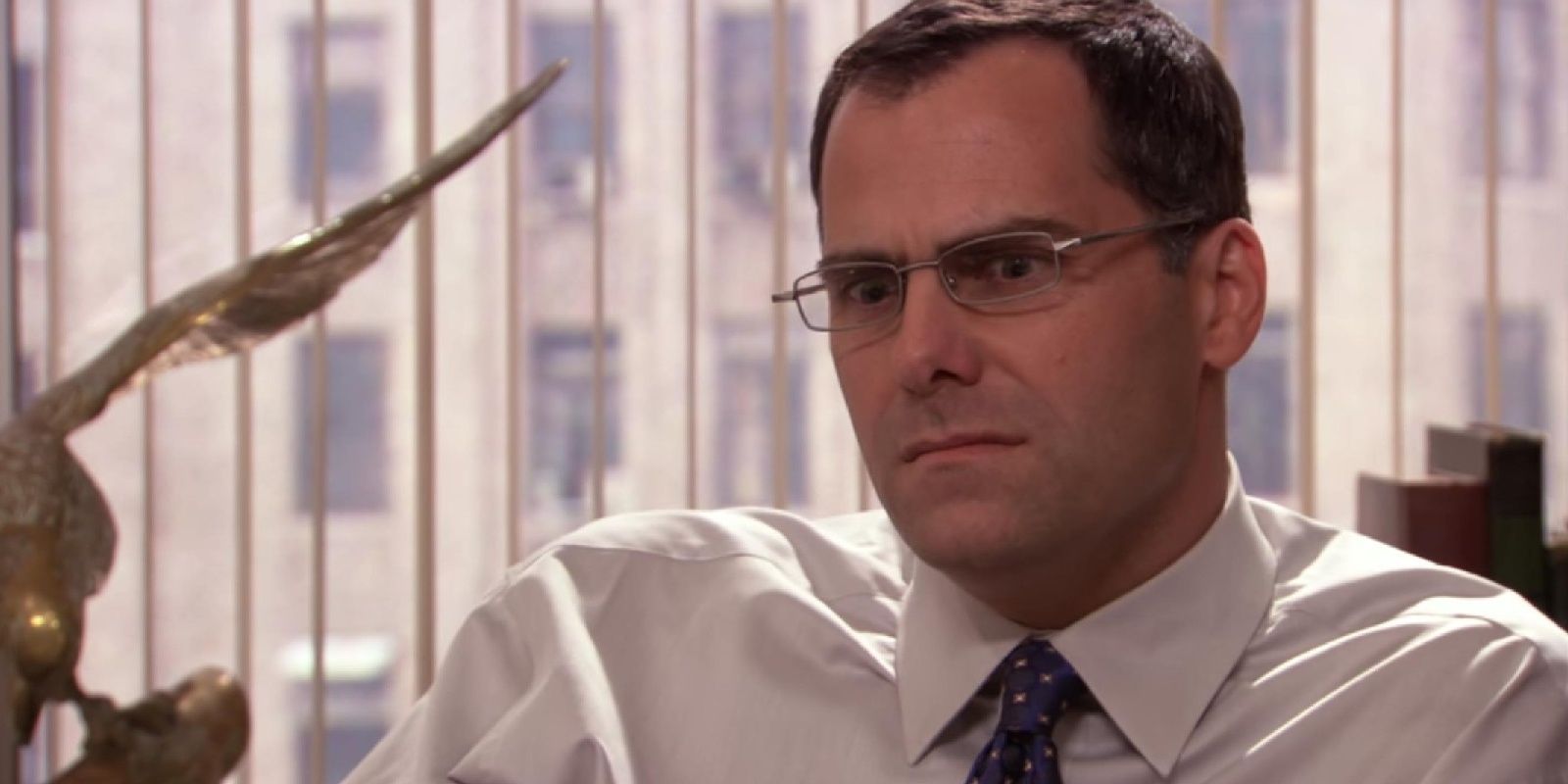Close up of David Wallace looking concerned and confused in The Office