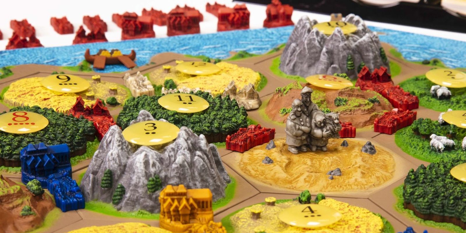 Catan 3D Edition board game being played on the table.