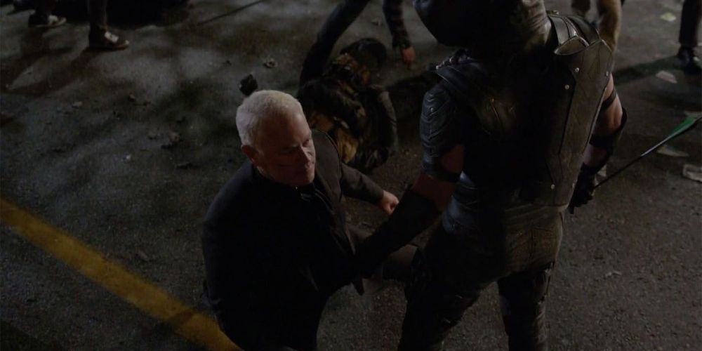 Oliver Queen stabs Damien Darhk with an arrow in Arrow