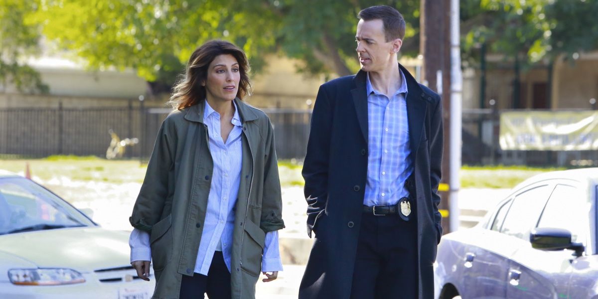 Quinn (played by Jennifer Esposito) and McGee (played by Sean Murray) walk down a street in NCIS