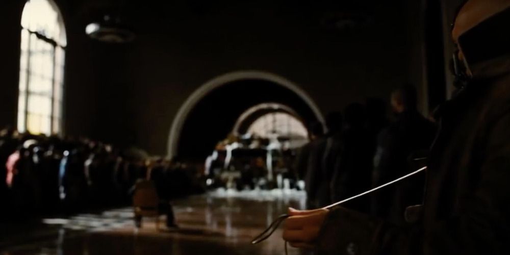 Bane knitting in the courtroom in Dark Knight Rises