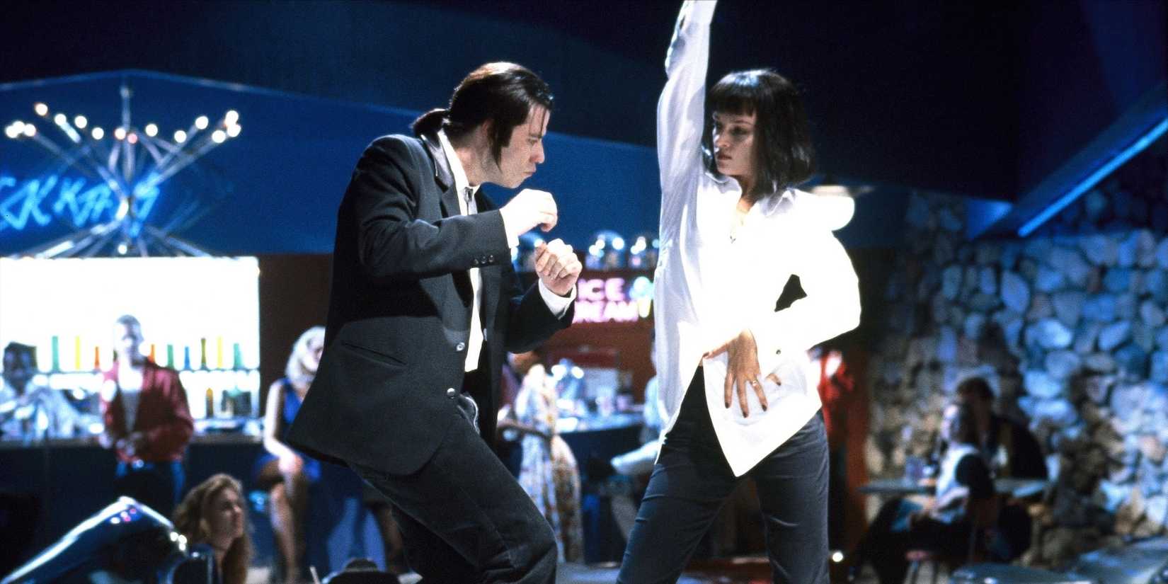 John Travolta (Vincent) and Uma Thurman (MIA) dance in a paste bar.