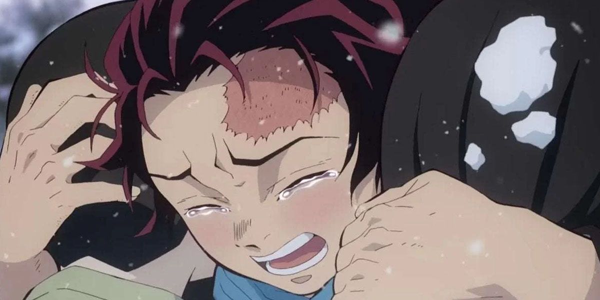 Tanjiro hugs the dream version of his siblings and cries