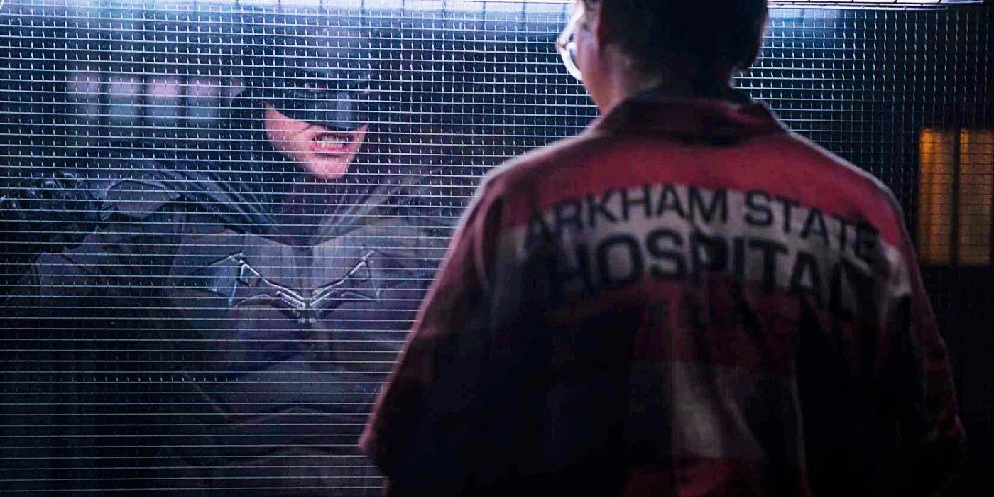 The Batman talking to Riddler in Arkham