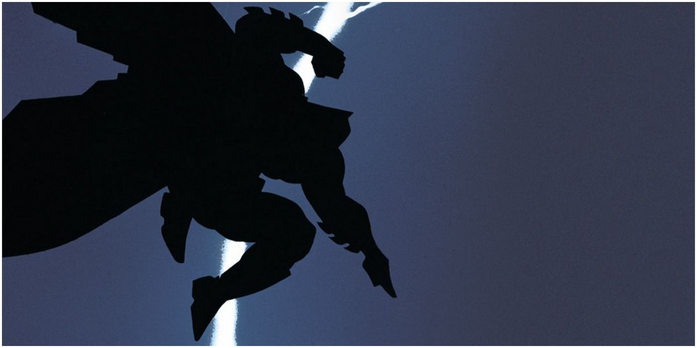 A silhouette of Batman in the night sky