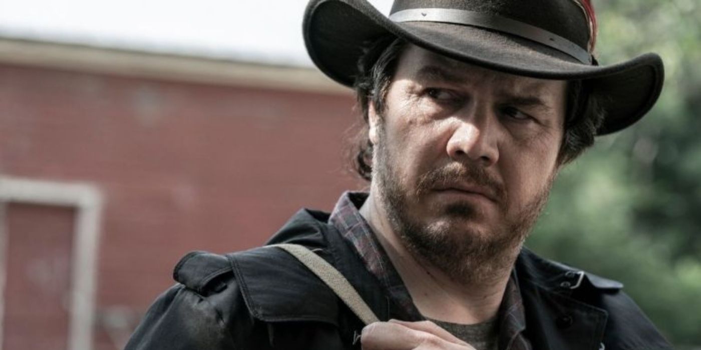 Eugene looking side-eyed, and wearing a cowboy hat in The Walking Dead