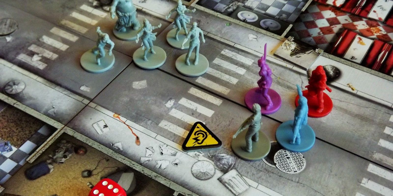Zombicide board game being played on a table.
