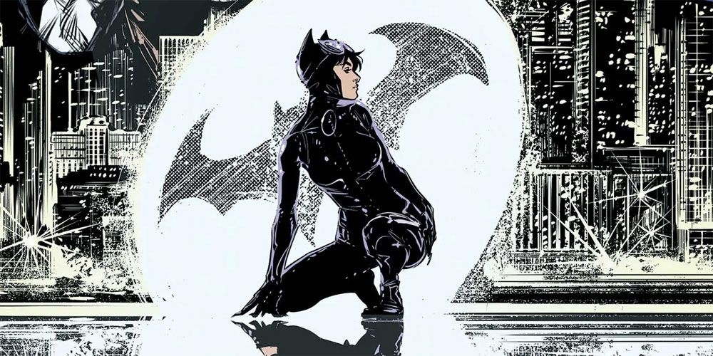 DC's Catwoman kneeling in front of the Bat-Signal