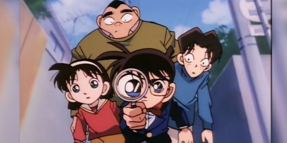 The Junior Detective League with Conan looking through his magnifying glass in Case Closed