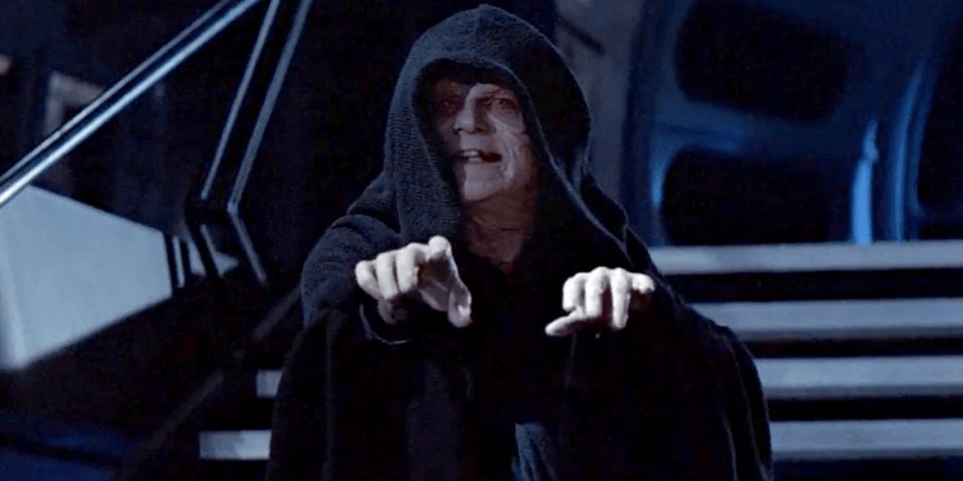 Emperor Palpatine prepares to fire force lightning with his hands in Return of the Jedi