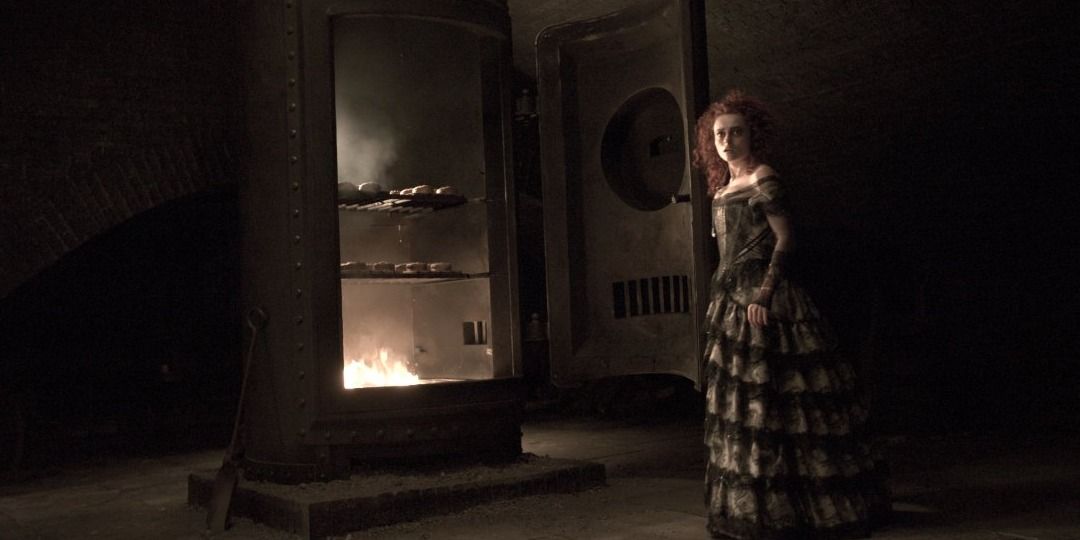 Mrs. Lovett stands by her oven, Sweeney Todd