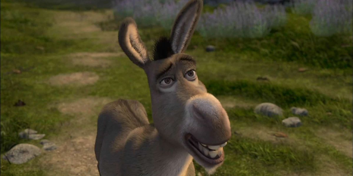 Donkey from Shrek in the grass grinning