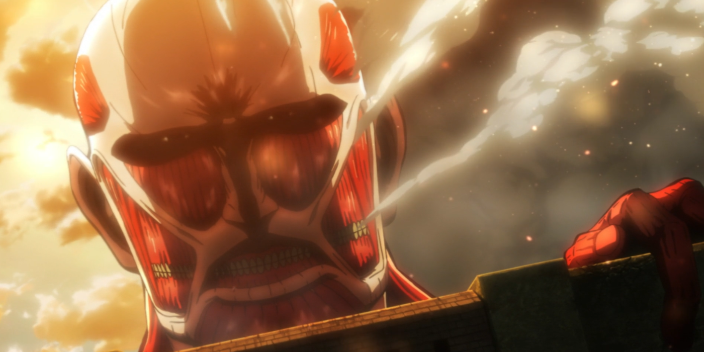 Bertholdt's Colossal Titan destroys the gate of Shiganshina in Attack on Titan.