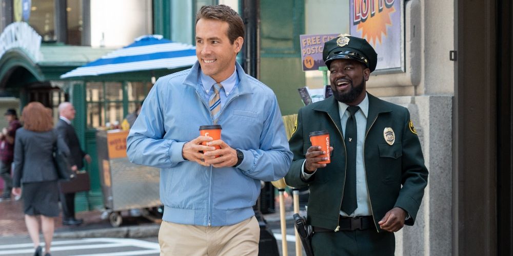 Guy and Buddy getting coffee in  Free Guy movie Ryan Reynolds