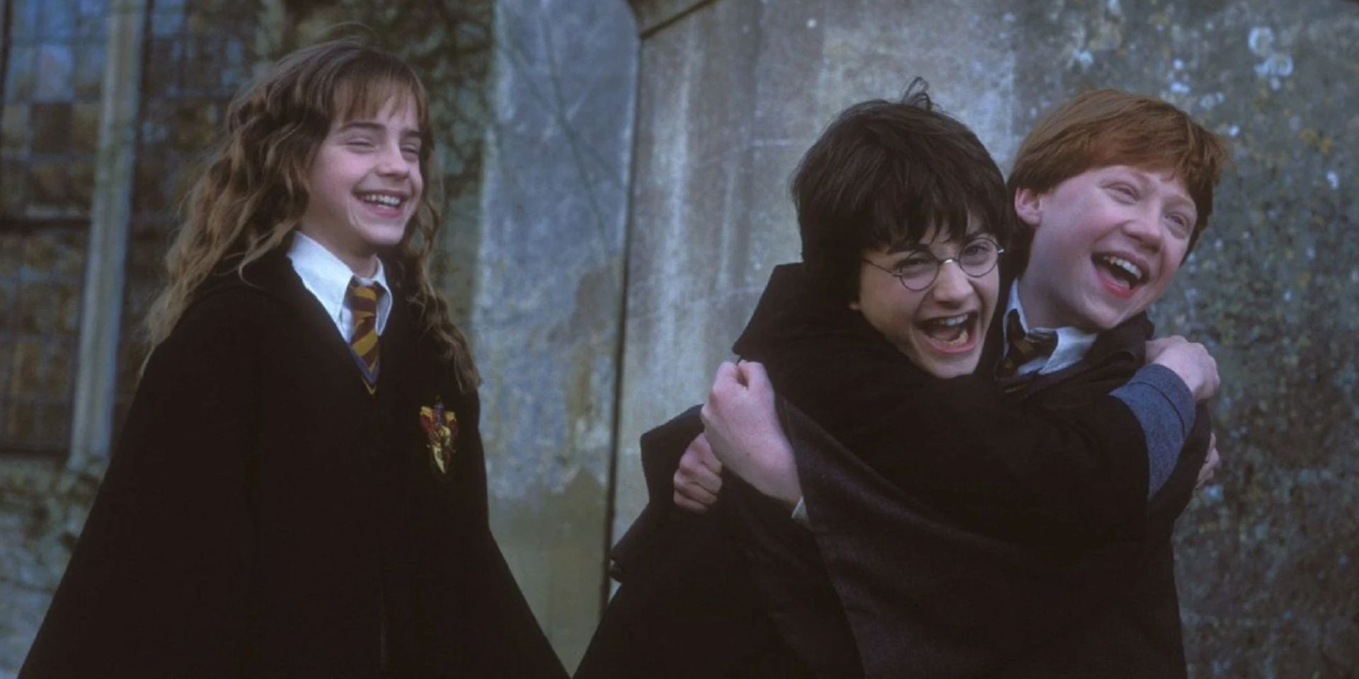 Hermione, Harry, and Ron celebrate in Harry Potter