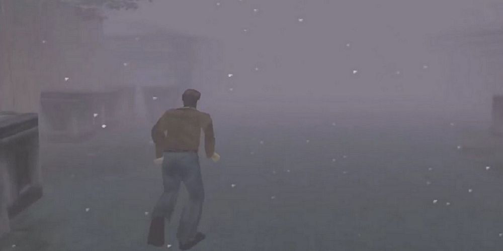 Harry Mason running through the foggy streets of Silent Hill game
