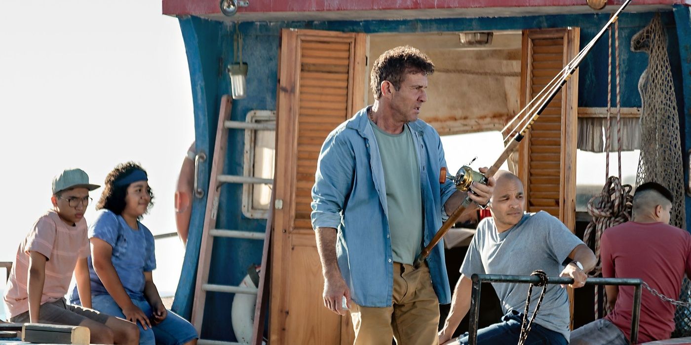 Captain Wade (Dennis Quaid) and his crew look out to sea while in a fishing boat in Blue Miracle.