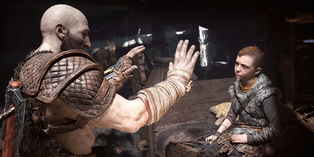 Kratos teaching Atreus to throw a punch in God of War 2018