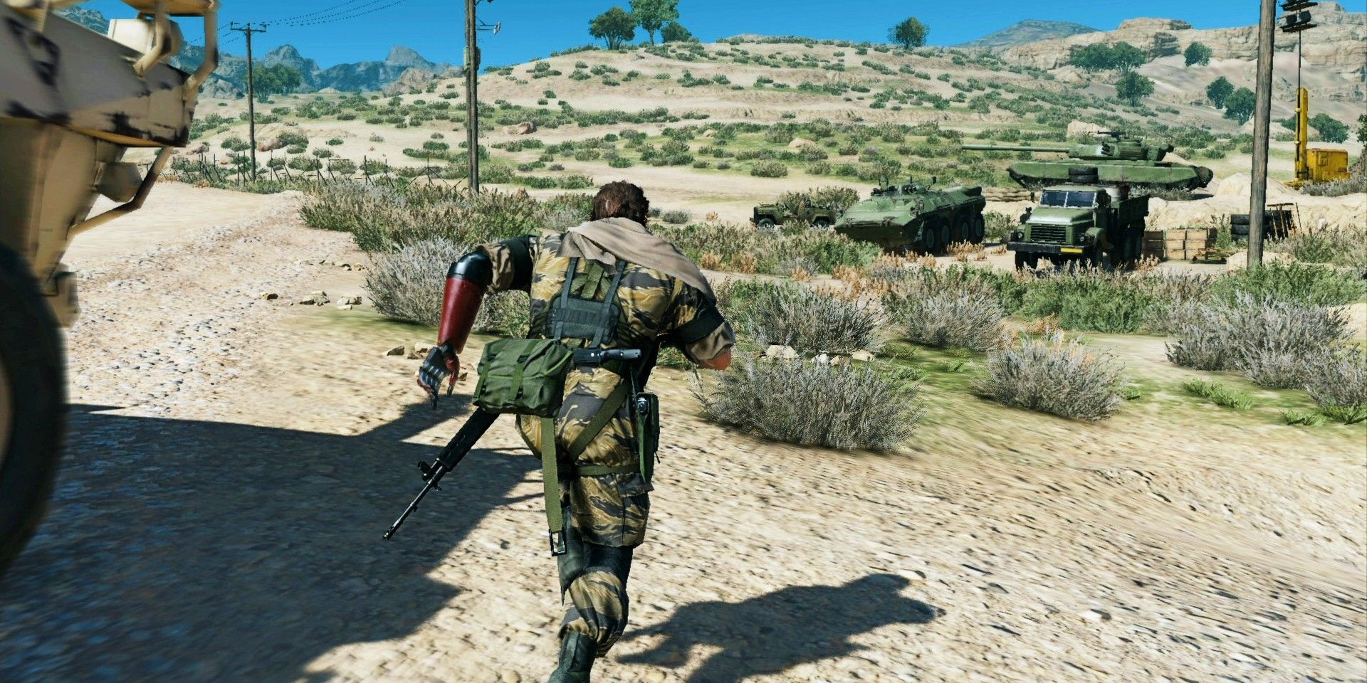 Screenshot depicting Metal Gear Solid V: The Phantom Pain gameplay, featuring Snake on the move.