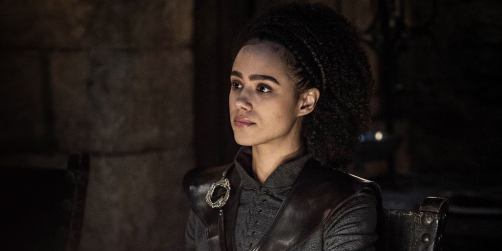 Missandei sitting with a neutral expression