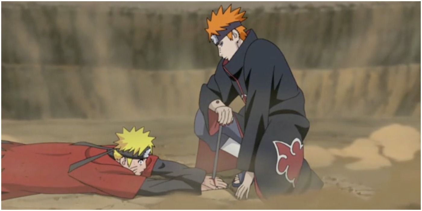 Pain kneeling and looking at Naruto while stabbing his hand in Shippuden.