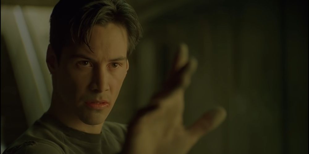 Neo gestures to Agent Smith during their fight in The Matrix