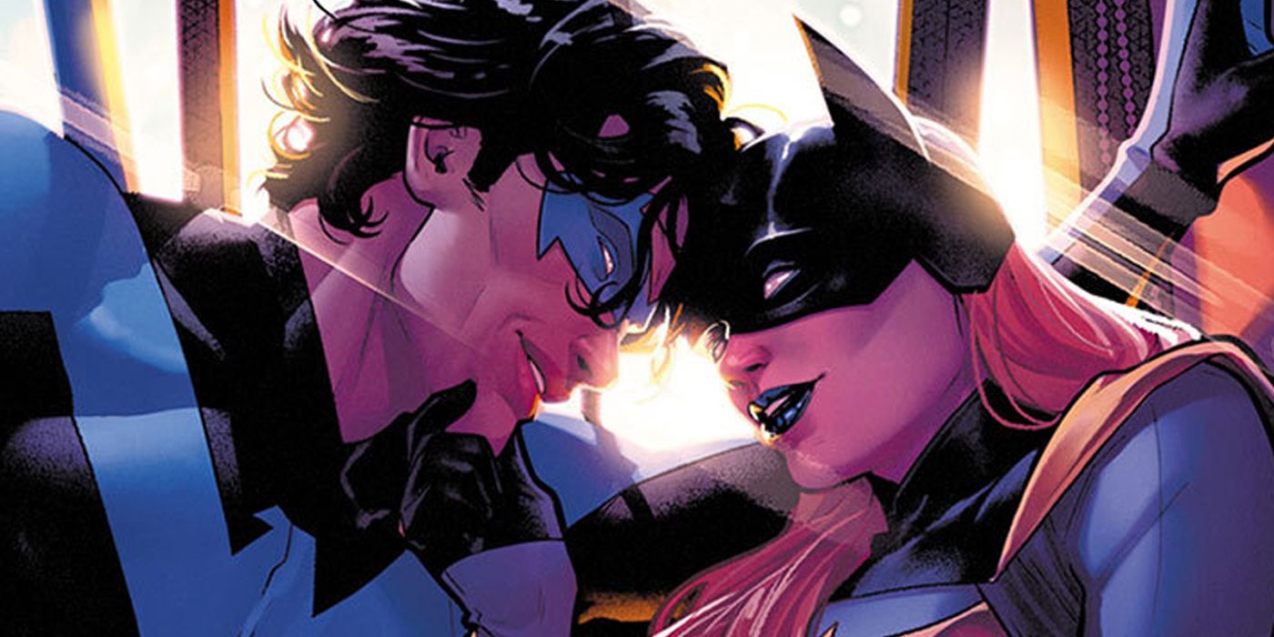 Nightwing and Batgirl getting close under spotlights