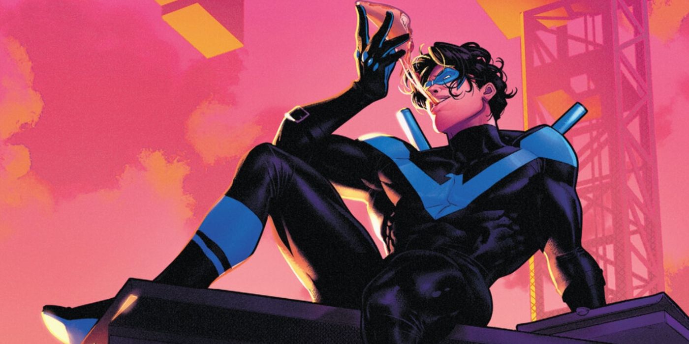 Nightwing from Teen Titans eating pizza while sitting on the roof of a building.