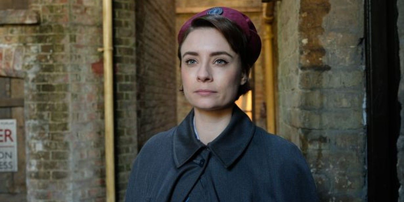 Nurse-Valerie-Dyer looks straight ahead in an alley on Call the Midwife