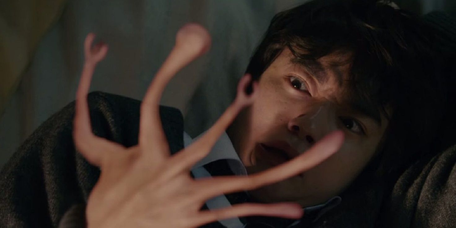 Shinichi watches Migi take over his hand in Parasyte Live-Action Movie