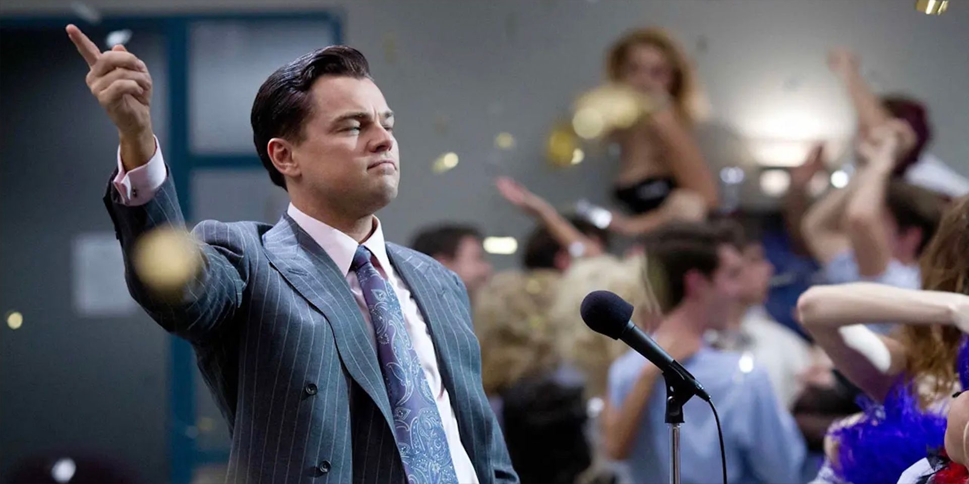 Leonardo DiCaprio points up in The Wolf Of Wall Street.