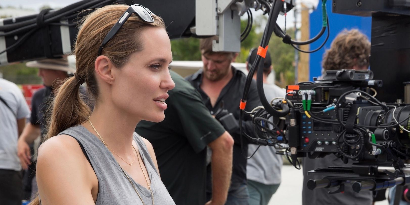 Angelina Jolie sitting behind the camera as the director.