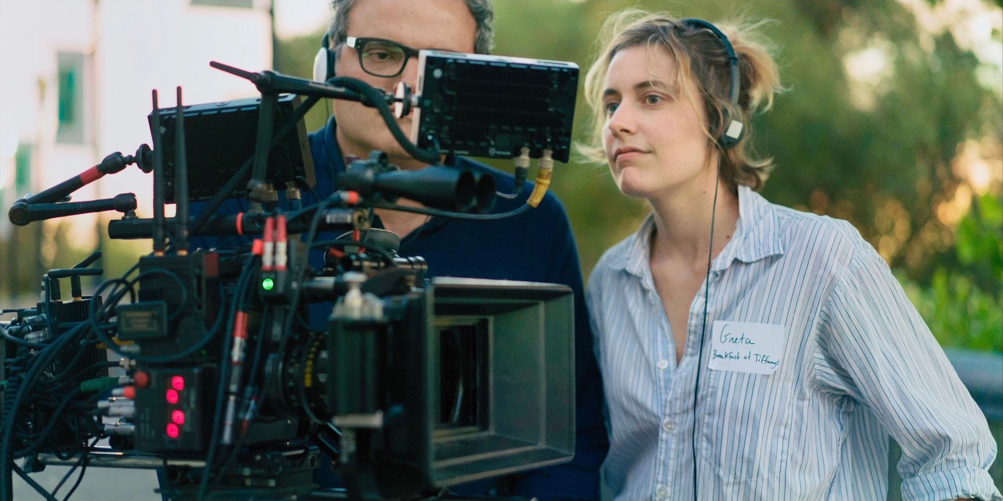 Greta Gerwig looking at a shot while directing.