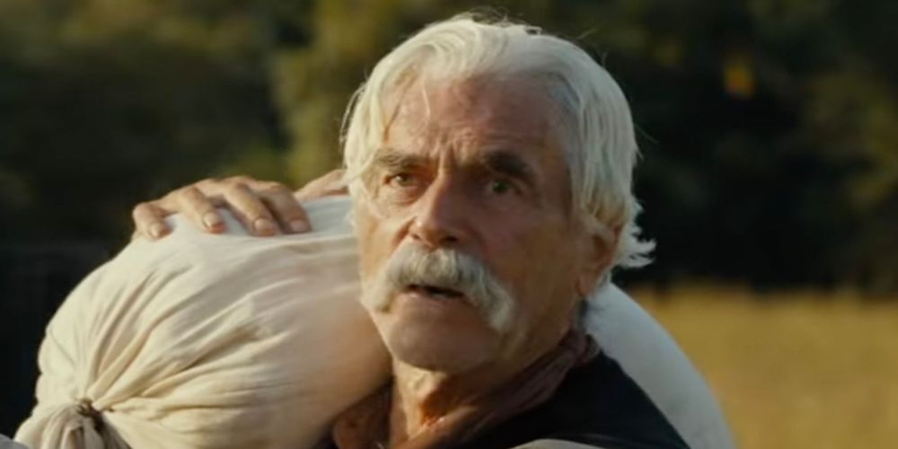Shea Brennan (Sam Elliott) carries a sack in 1883
