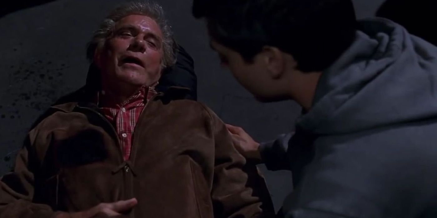 Peter Parker kneels by his dying Uncle Ben