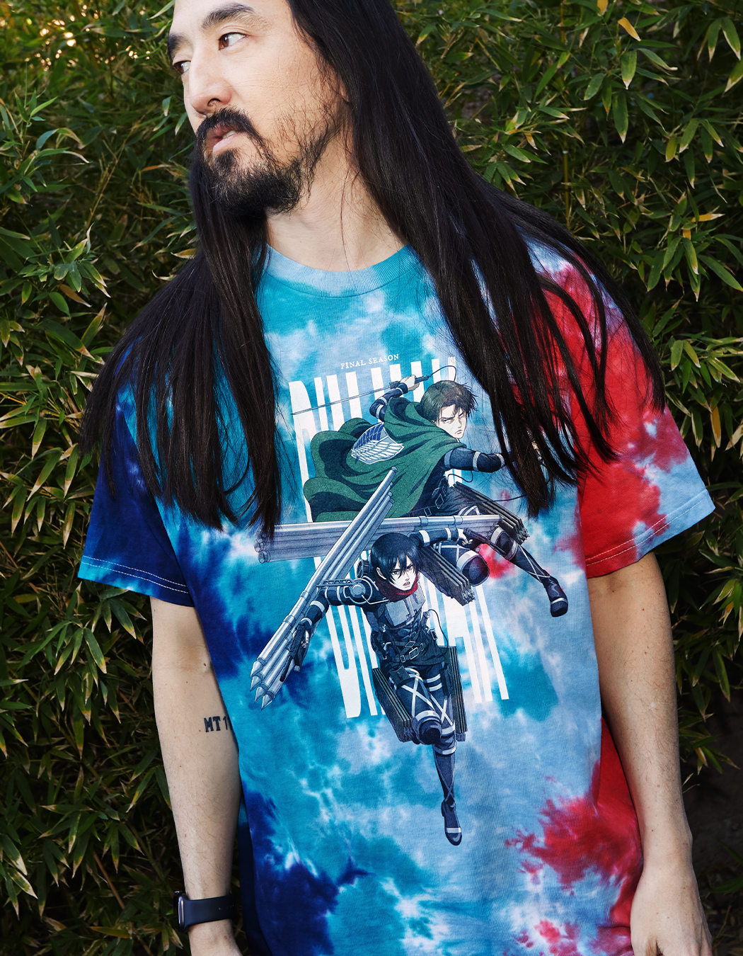 Steve Aoki modelling Levi and Mikasa tie-dye shirt from Dim Mak x Attack on Titan Collaboration
